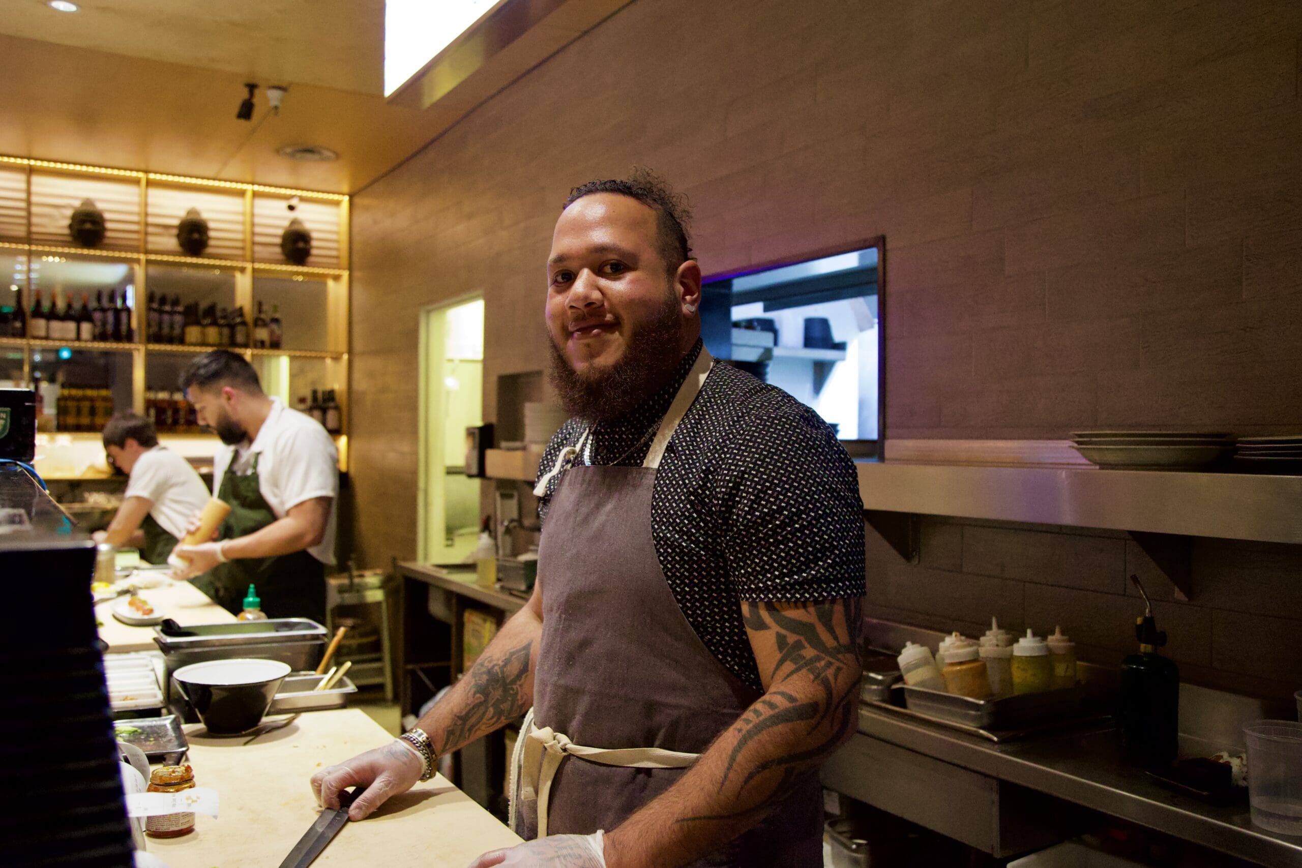 a man standing in a kitchen preparing food