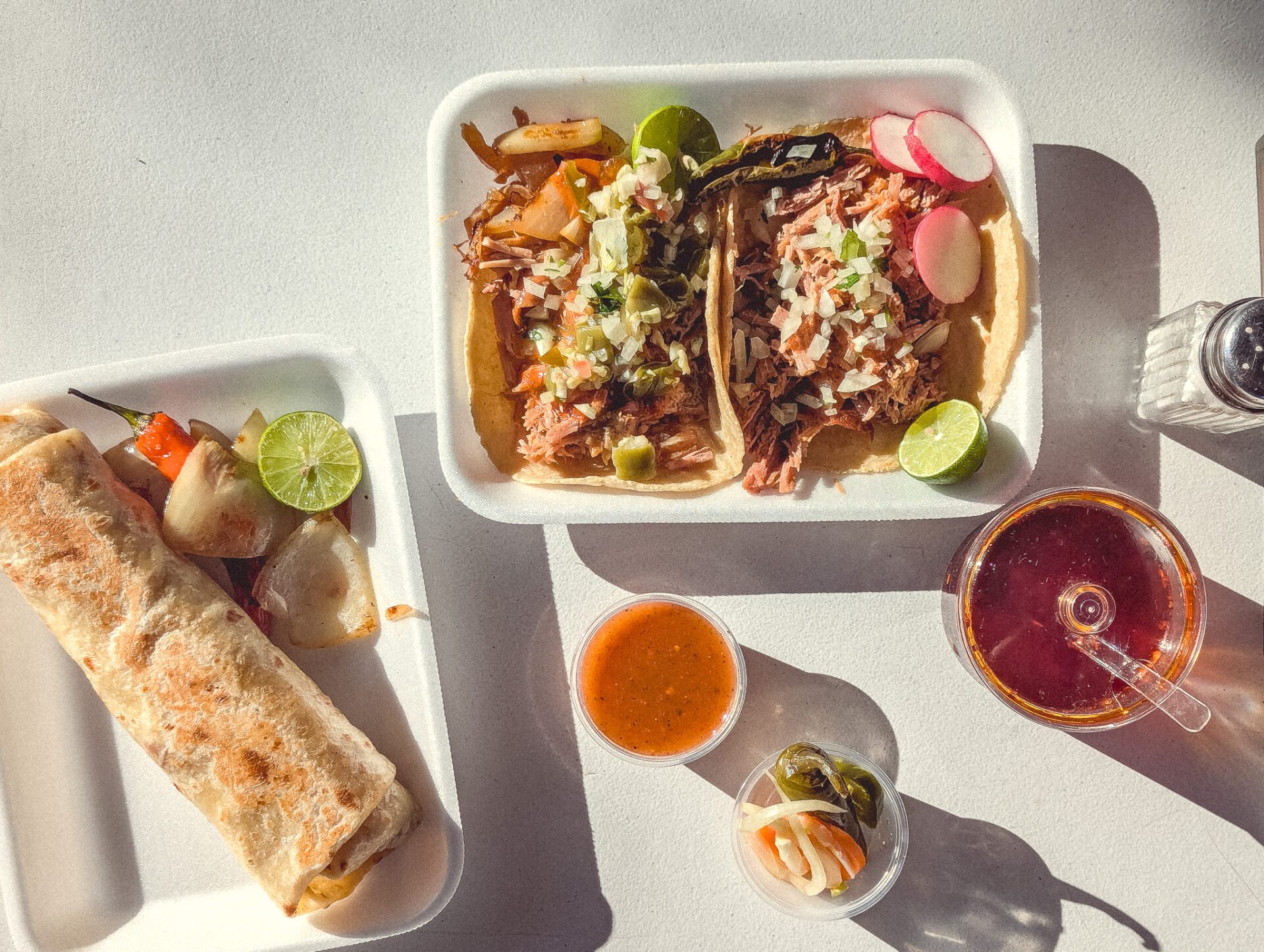 Tacos de mixto y carnitas, breakfast burrito at Carnitas El Huracán Del Sur (Photo by Jackie Tran)