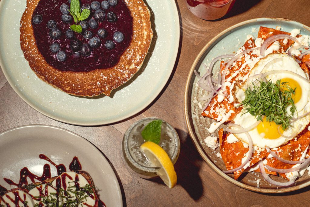 Blueberry pancakes, RealGood chilaquiles, and lemonade at RealGood Brunch Co. (Photo by Jackie Tran)