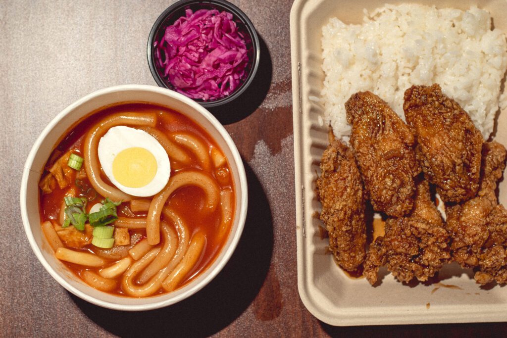 Noodle tteokbokki and soy garlic chicken with rice at Oh My Chicken (Photo by Jackie Tran)