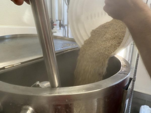 It is all a part of the process. Evie Tran adds ingredients to perfect her Kiwi Strawberry Blonde Ale. (Courtesy of Patrick Heacock)