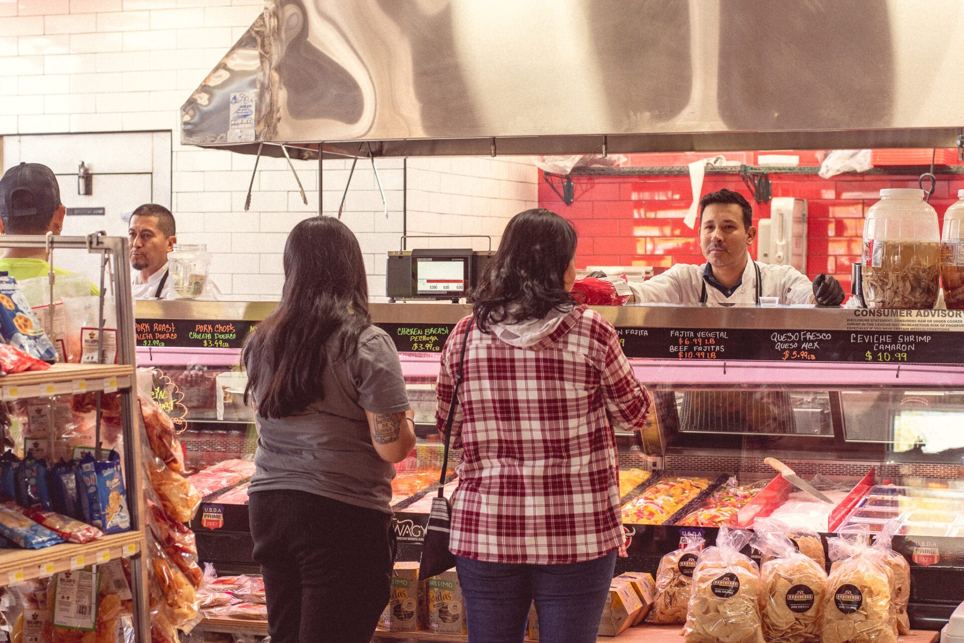 Owner-partner Luiz Lopez at the meat counter at Rancheros Carniceria on Grant Road (Photo by Jackie Tran)