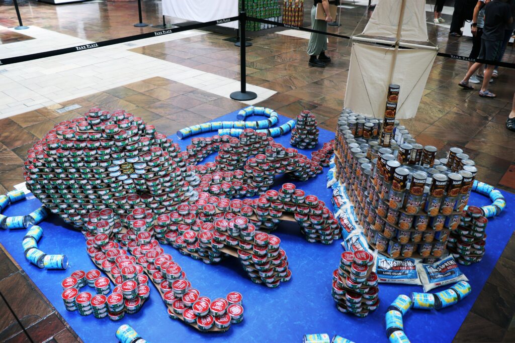 "Kraken Down on Hunger" by Team Onyx Creative for Canstruction Tucson 2024 (Photo courtesy of Community Food Bank of Southern Arizona)
